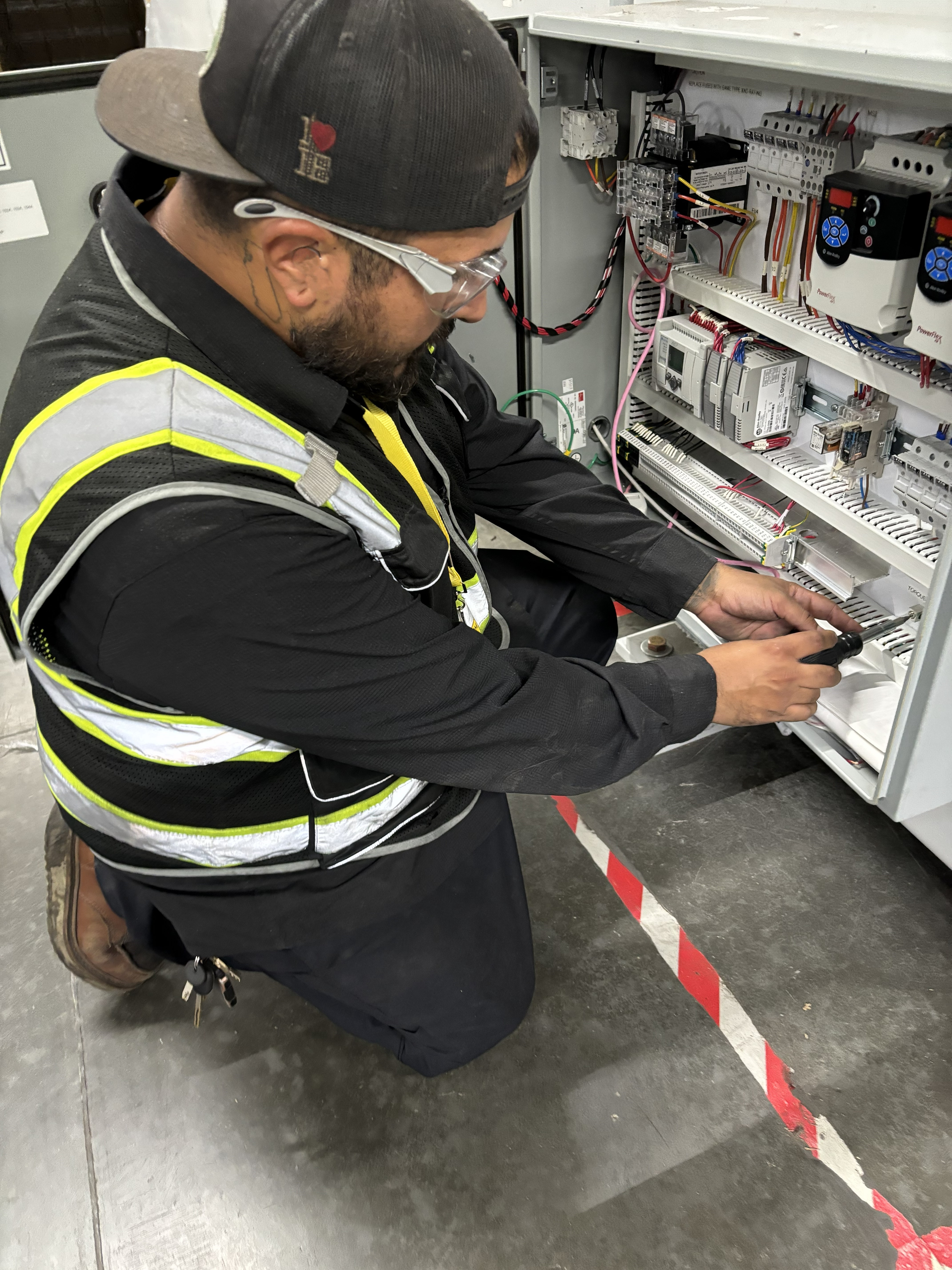 Technician working on conveyor control systems